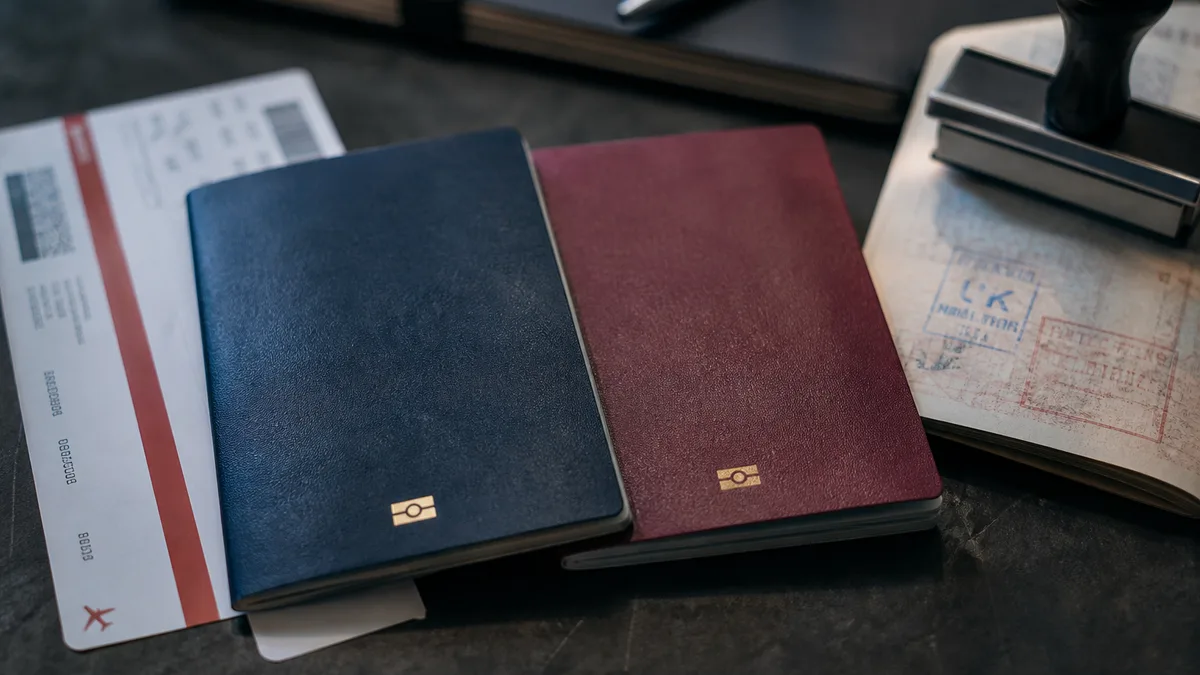 Two passports beside a boarding pass — UK dual nationality passport rules 2026 (AI-generated illustration)