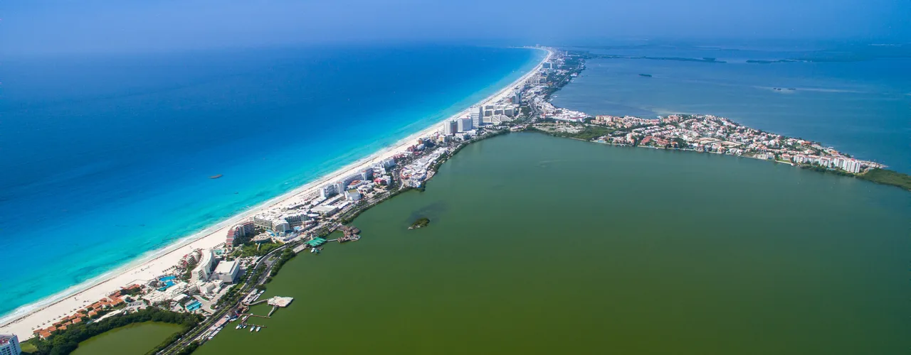 Aerial view of Cancún’s white-sand beach and turquoise Caribbean water