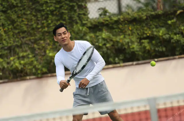 Guest mid-serve on the AYANA Midplaza Jakarta courts