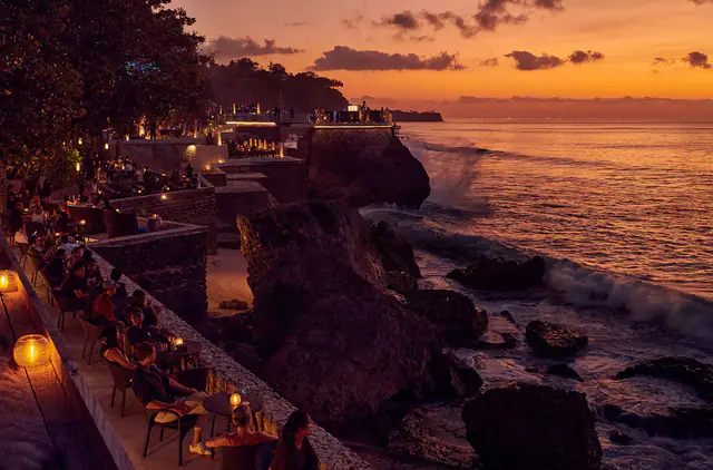 Clifftop restaurant terraces at AYANA Resort Bali at sunset