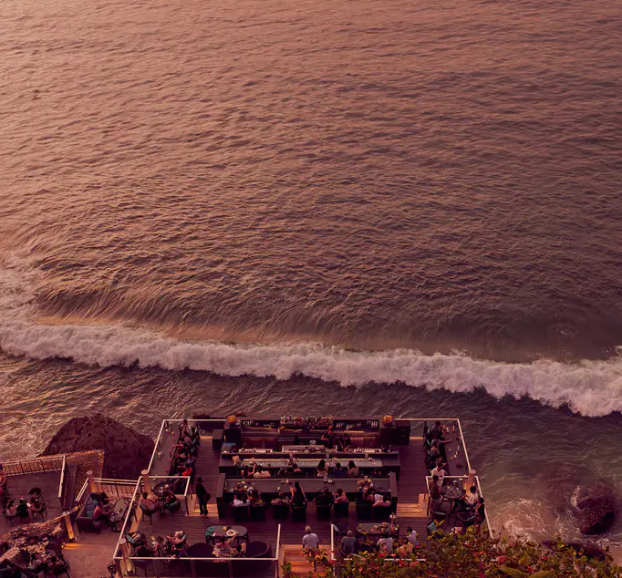 Surf rolling onto the Jimbaran coastline below AYANA Resort Bali