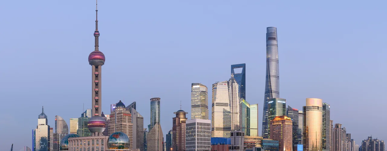 Pudong skyline across the Huangpu River in Shanghai, with the Oriental Pearl Tower and Lujiazui towers