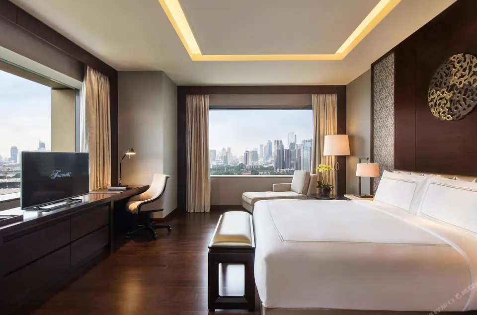 King room at Fairmont Jakarta with floor-to-ceiling views over the Senayan skyline