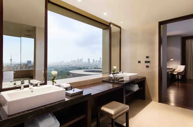 Corner guest room at Fairmont Jakarta overlooking central Jakarta