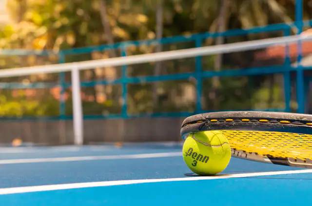 Tennis ball on the net at the Grand Hyatt Jakarta courts