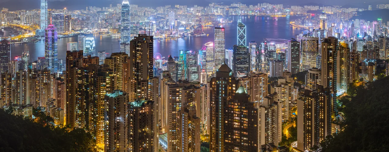 Hong Kong Island skyline across Victoria Harbour at dusk