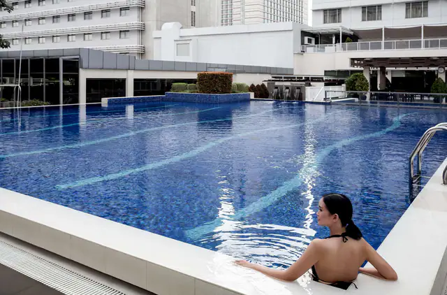 Guest swimming in the pool at Pullman Jakarta Indonesia Thamrin CBD