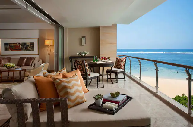 Oceanfront suite terrace with daybeds at The Mulia Bali