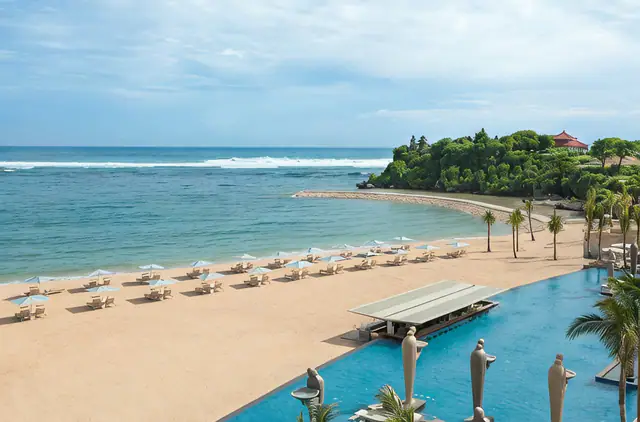 Beachside pool and gardens at The Mulia Bali