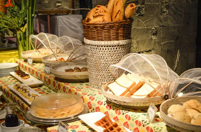 Breakfast buffet with rattan covers at Tijili Hotel Seminyak