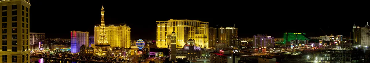 Las Vegas Strip skyline at dusk with resort towers and neon along Las Vegas Boulevard