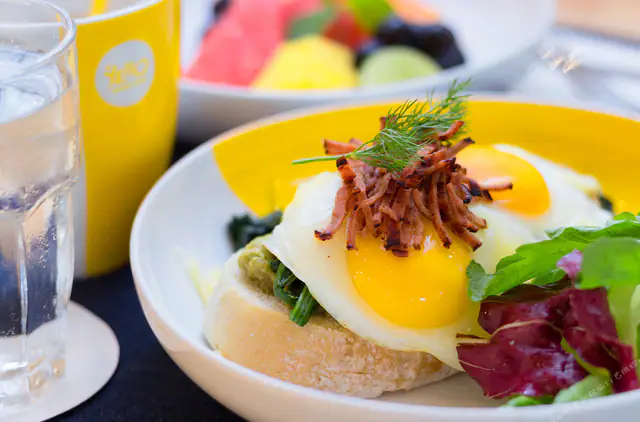 Eggs benedict and fruit at Yello Hotel Kuta Beachwalk